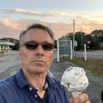 Nauset Ice Cream - Me with my ice cream cone, eating in parking lot.   Mint chocolate chip ice cream on sugar cone- medium - Ice Cream & Frozen Yogurt Near Me - Eastham, Massachusetts