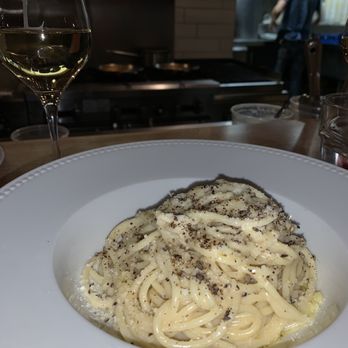 Luciano Trattoria - a plate of pasta and a glass of wine - Italian Near Me - Montreal, Quebec