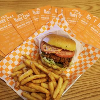 Holy Cow - a burger and french fries on a table - Burgers Near Me - Dallas, Texas Holy Cow - a burger and french fries on a table - Burgers Near Me - Dallas, Texas