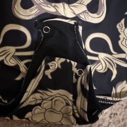 AMS Alterations Tailor Shop - A bathing suit that had broken buttons