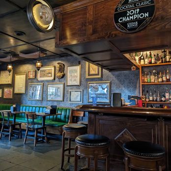The Map Room - a bar with a clock on the wall - American Near Me - Cedar Rapids, Iowa The Map Room - a bar with a clock on the wall - American Near Me - Cedar Rapids, Iowa