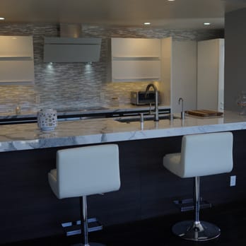 LeahDDesigns - Century City condo - modern kitchen with stainless and espresso wood accents that is a good mix of both masculine and feminine. - Interior Design Near Me