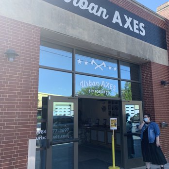 Urban Axes - Durham - a man standing outside of a building - Bars Near Me - Durham, North Carolina