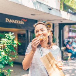 Tasty Bites Food Tours - Enjoying pastry from the city's best panadería.