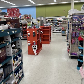 Walgreens - Inside Walgreens, the store features shelves stocked with various products, including holiday-themed decorations such as plush toys and ornaments. The aisle is wide and well-lit, with a sign indicating the location of restrooms in the background. The ceiling has fluorescent lighting, and the walls are painted in blue and green. The store appears organized, with displays and shelves arranged for customer browsing. - Cosmetics & Beauty Supply Near Me - Severna Park, Maryland