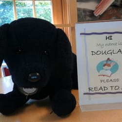 Kitsap Regional Library - This is Douglas, the stuffed dog in the kids area that children use for company or a friend to read to :)
