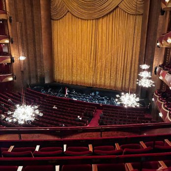 The Metropolitan Opera - We were one or two tiers up.  The sparkly chandeliers retract when the lights dim so as not to obscure anyone's view. - Opera & Ballet Near Me - New York, New York