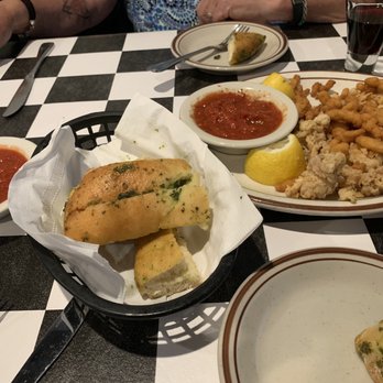 Piccolino - Fried Calamari and clams.  Hot garlic bread and sauce.  Don't fill up before the main course - Italian Near Me - Santa Fe, New Mexico