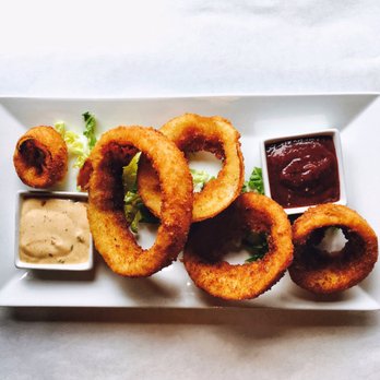 Twisted Fish Steakhouse - The onion ring appetizers, excellently plated, tasted even better - Steakhouses Near Me - Seaside, Oregon