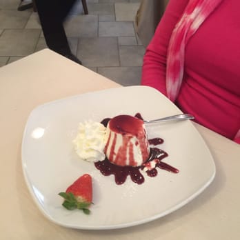 L'Antico Pozzo - Pane cotta with mixed wild berry sauce. - Italian Near Me - Bellagio, Colorado L'Antico Pozzo - Pane cotta with mixed wild berry sauce. - Italian Near Me - Bellagio, Colorado