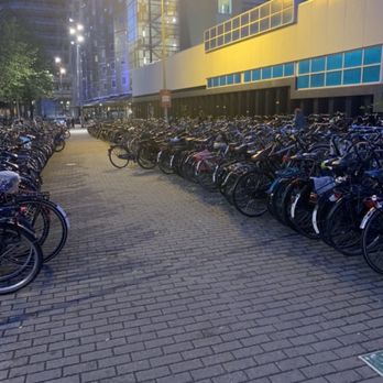 Hanky Panky Tattoo Studio - Amsterdam transportation  Thousands of bikes! Bike parking garages? Bike roundabouts? Yes, indeed! - Tattoo Near Me - Amsterdam, New Hampshire