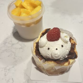 Sweet General Bakery Cafe - Basque cheesecake and mango coconut pudding - Cafes Near Me - Westmont, Illinois Sweet General Bakery Cafe - Basque cheesecake and mango coconut pudding - Cafes Near Me - Westmont, Illinois