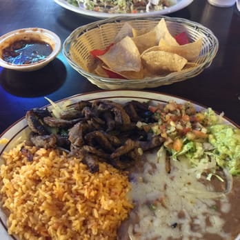 El Patron - Steak fajitas in foreground and huaraches in back. - Mexican Near Me - Bakersfield, California El Patron - Steak fajitas in foreground and huaraches in back. - Mexican Near Me - Bakersfield, California