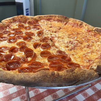 Smiling With Hope Pizza - New York style pizza - half cheese, half pepperoni. - Pizza Near Me - Reno, Nevada Smiling With Hope Pizza - New York style pizza - half cheese, half pepperoni. - Pizza Near Me - Reno, Nevada
