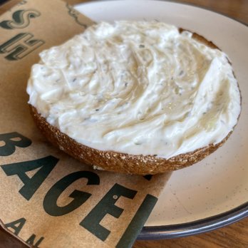 Good Bagels - Skimpflation who? Look at all of the onion&herb spread of this bagel! Thank you! - Coffee & Tea Near Me - Anacortes, Washington