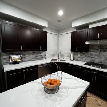ACG Consult&Construct - a bowl of oranges on a kitchen island - General Contractors Near Me - San Diego, California