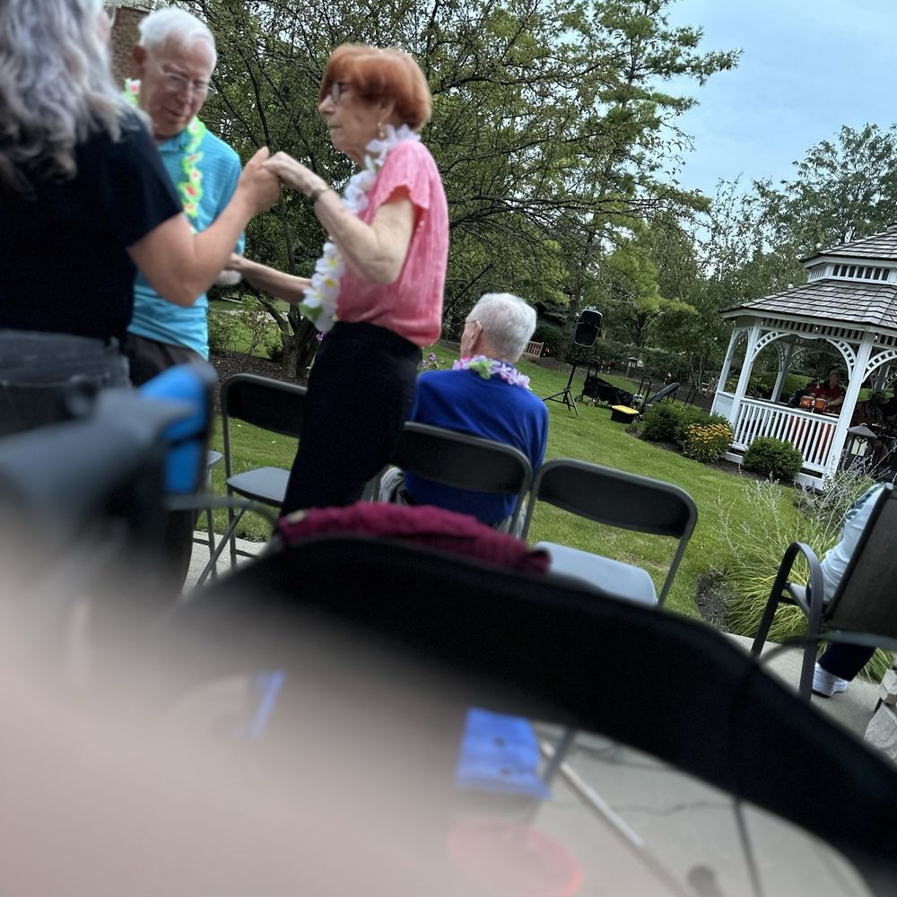 Chestnut Square at The Glen - Dancing with ibis wife.  Gazebo in back holds the  Band. - Retirement Homes Near Me - Glenview, Illinois