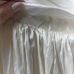 Rex Fabrics - Popped stitch from the employees trying to force the dress to close