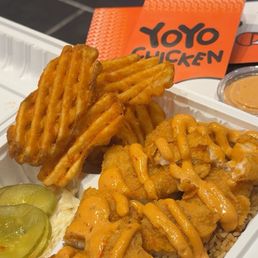 Fish and waffle fries over rice Fish and waffle fries over rice