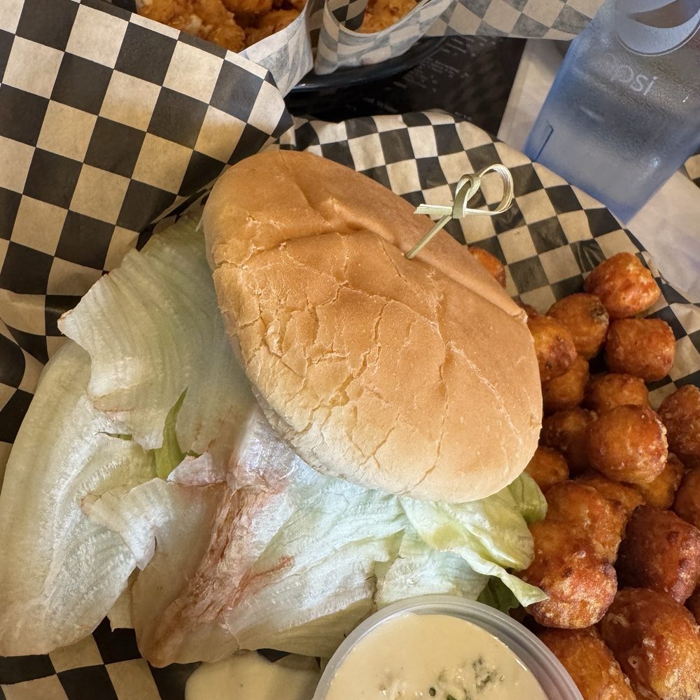 J DUB - Caprese Chicken Sandwich with sweet potato tots and blue cheese dressing, with Cheese Curds in the background - Breakfast & Brunch Near Me - Bend, Oregon J DUB - Caprese Chicken Sandwich with sweet potato tots and blue cheese dressing, with Cheese Curds in the background - Breakfast & Brunch Near Me - Bend, Oregon
