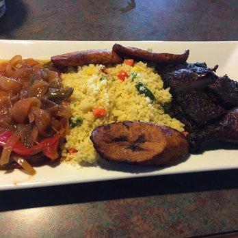 Jiallo's - Jerk chicken lunch with fried plaintains and couscous sides - Caribbean Near Me - Indianapolis, Indiana Jiallo's - Jerk chicken lunch with fried plaintains and couscous sides - Caribbean Near Me - Indianapolis, Indiana