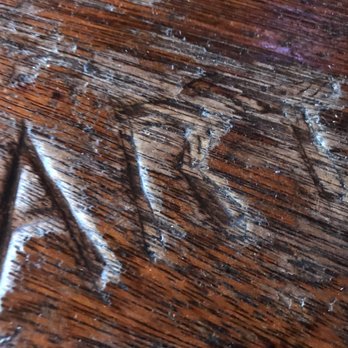 Rebar Saloon - a close up of a wooden table - Bars Near Me - Saco, Montana