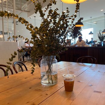 Tatte Bakery & Cafe | South Boston - a vase of flowers on a table - Bakeries Near Me - Boston, Massachusetts Tatte Bakery & Cafe | South Boston - a vase of flowers on a table - Bakeries Near Me - Boston, Massachusetts