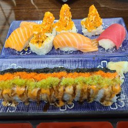 Happy Garden - Nigiri sake, Maguro, Volcano roll,, Scallop roll in the front.