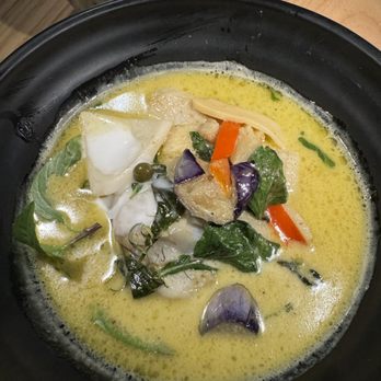 Lao Lao Bar - Green Curry Fish: This dish featured spicy green chili curry with fresh Thai basil, pea eggplants, and young coconut meat. The basa fish was - Laotian Near Me - Toronto, Ontario