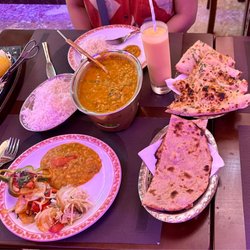 Natraj Tandoori - Garlic nan bread, dal tadka, rice, mango lassi, tandoori chicken and roti.