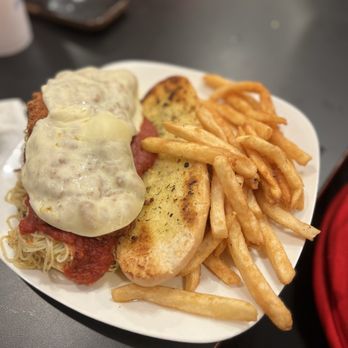 Tropical Trader - Chicken Parmesan sandwich with a side of fries - Seafood Near Me - Panacea, Florida