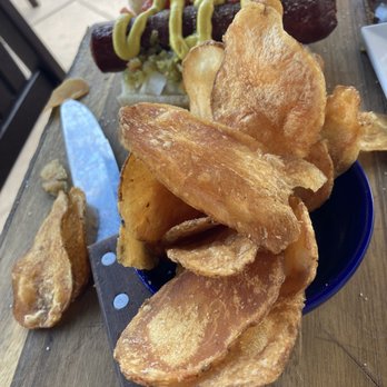 The Cellar Upstairs - Half a datil hot dog served with house made chips. Both were outstanding. - Wine Bars Near Me - St. Augustine, Florida