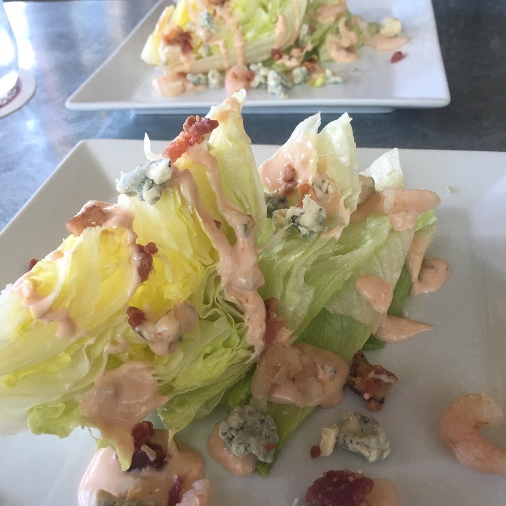 The Saddle Room - The Wedge Salad. Thousand island dressing, bacon bits, bleu cheese chunks and shrimp. Simple and refreshing! - Dive Bars Near Me - Waimea, Hawaii The Saddle Room - The Wedge Salad. Thousand island dressing, bacon bits, bleu cheese chunks and shrimp. Simple and refreshing! - Dive Bars Near Me - Waimea, Hawaii