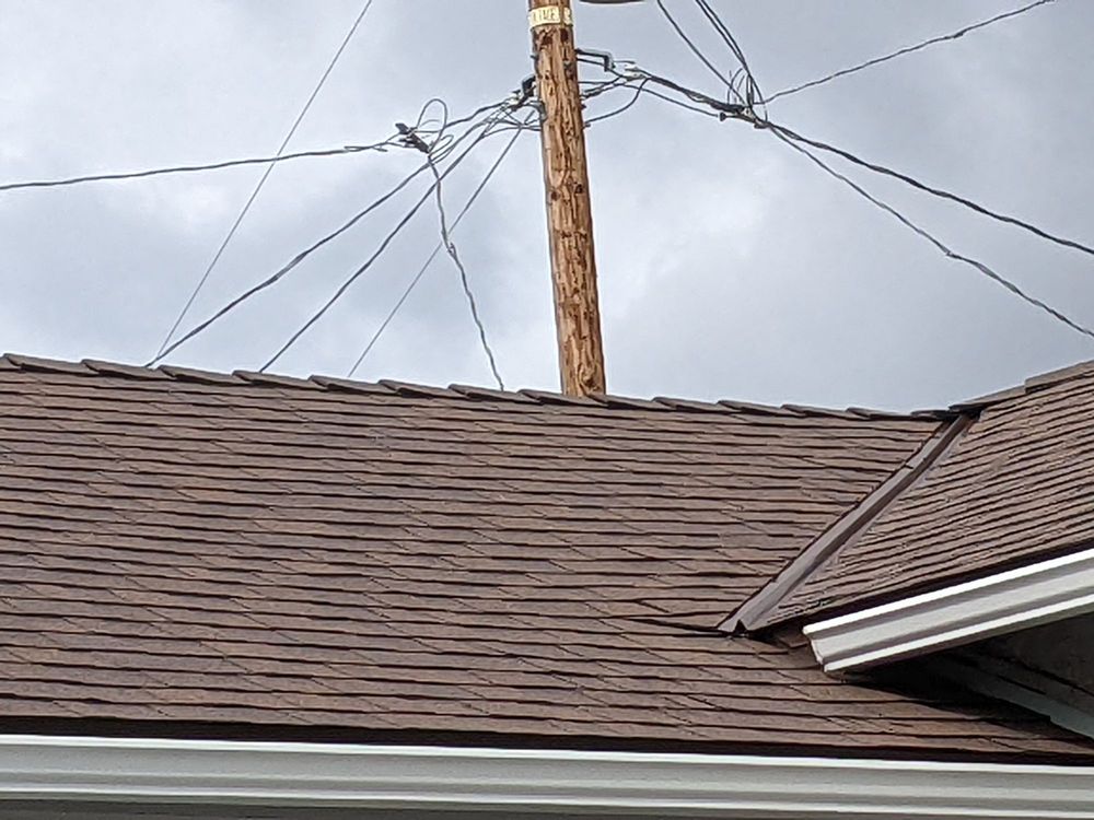 Slide of Rescue Roofing Construction