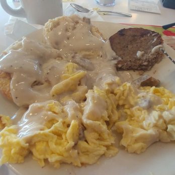 Steak ’n Shake - after the gravy was put on the egg and the biscuit just before cutting into that delicious sausage Rock On - Burgers Near Me - Lincoln, Illinois