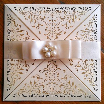 Jolie Royale - Square laser cut invitation trimmed with a matching satin bow and an exquisite pearl brooch. - Party & Event Planning Near Me - Miami, Florida Jolie Royale - Square laser cut invitation trimmed with a matching satin bow and an exquisite pearl brooch. - Party & Event Planning Near Me - Miami, Florida