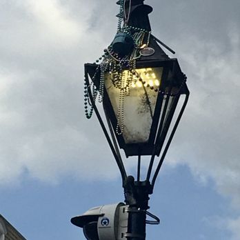 Bourbon Street - Marci Gras beads on the beautiful street lights. - Local Flavor Near Me - New Orleans, Louisiana Bourbon Street - Marci Gras beads on the beautiful street lights. - Local Flavor Near Me - New Orleans, Louisiana