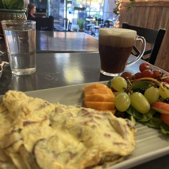 Le Testimony Organic Bistro - Mushroom and bacon omelet with a side of fruit. Dairy free hazelnut latte. - Creperies Near Me - Redding, California Le Testimony Organic Bistro - Mushroom and bacon omelet with a side of fruit. Dairy free hazelnut latte. - Creperies Near Me - Redding, California