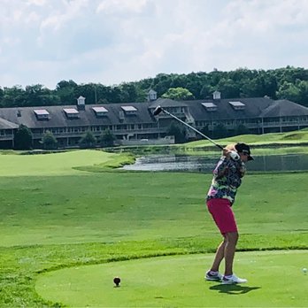 Eagle Eye Golf Course - Teeing off on Hole # 18.  Huge Clubhouse and Banquet Center beyond. - Golf Near Me - Bath, Michigan