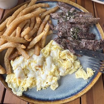 Lpcx Cafe - Grilled Steak CARNE ASADA. Eggs any style with Grilled Steak, chimichurri, and French fries. - Bakeries Near Me - Tampa, Florida Lpcx Cafe - Grilled Steak CARNE ASADA. Eggs any style with Grilled Steak, chimichurri, and French fries. - Bakeries Near Me - Tampa, Florida