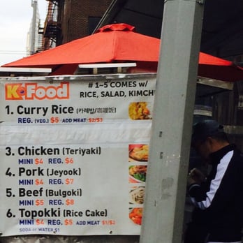 K-Food Cart - a man standing in front of a k - food cart - Street Vendors Near Me - New York, New York K-Food Cart - a man standing in front of a k - food cart - Street Vendors Near Me - New York, New York
