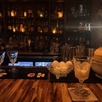 Knee High Stocking - a bar with a wooden bar top - Cocktail Bars Near Me - Seattle, Washington