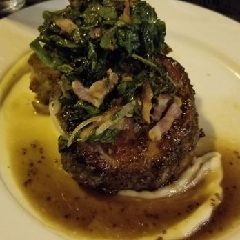 Union 50 - Nothing like a tomahawk pork chop covered with greens and true greatness. - Gastropubs Near Me - Indianapolis, Indiana