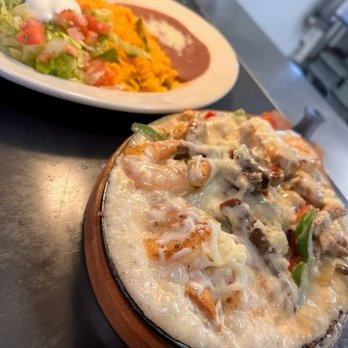 Catramex Restaurant - Shrimp, grilled steak, peppers, and melted cheese served with Mexican rice, refried beans, and a fresh side salad at Catramex... - Mexican Near Me - Saco, Maine Catramex Restaurant - Shrimp, grilled steak, peppers, and melted cheese served with Mexican rice, refried beans, and a fresh side salad at Catramex... - Mexican Near Me - Saco, Maine