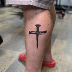 Jesus nails tattoo