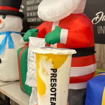 Presotea - a person holding a cup of coffee - Bubble Tea Near Me - Brossard, Quebec Presotea - a person holding a cup of coffee - Bubble Tea Near Me - Brossard, Quebec