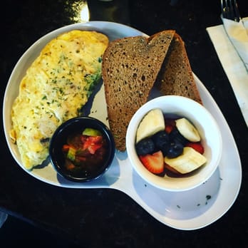 Two Chicks Cafe - Chicken and goat cheese omelette with homemade salsa on the side.. - Breakfast & Brunch Near Me - New Orleans, Louisiana