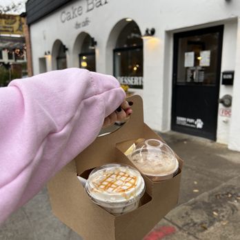 Cake Bar - The Cafe - - Iced Creme Brle Latte, Original Milk Tea with boba, and an Iced Caramel Macchiato packaged in a carry out case - Custom Cakes Near Me - Syracuse, New York