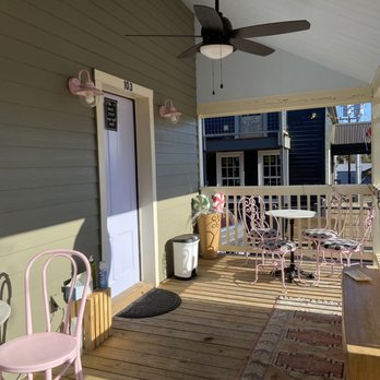 Lollitop Sweetshop - a porch with chairs and a table - Desserts Near Me - Round Top, Texas Lollitop Sweetshop - a porch with chairs and a table - Desserts Near Me - Round Top, Texas