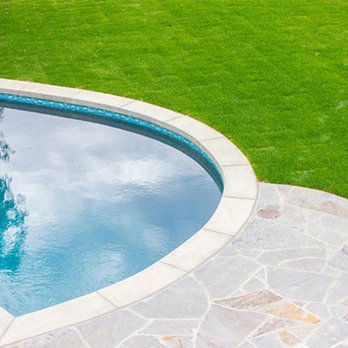 Schuster Pools & Construction - a pool in a backyard - Landscaping Near Me Schuster Pools & Construction - a pool in a backyard - Landscaping Near Me